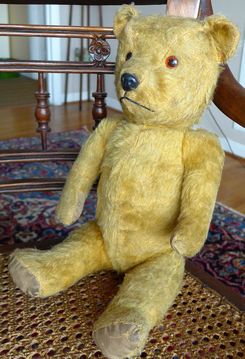 old teddy bear stuffed with straw